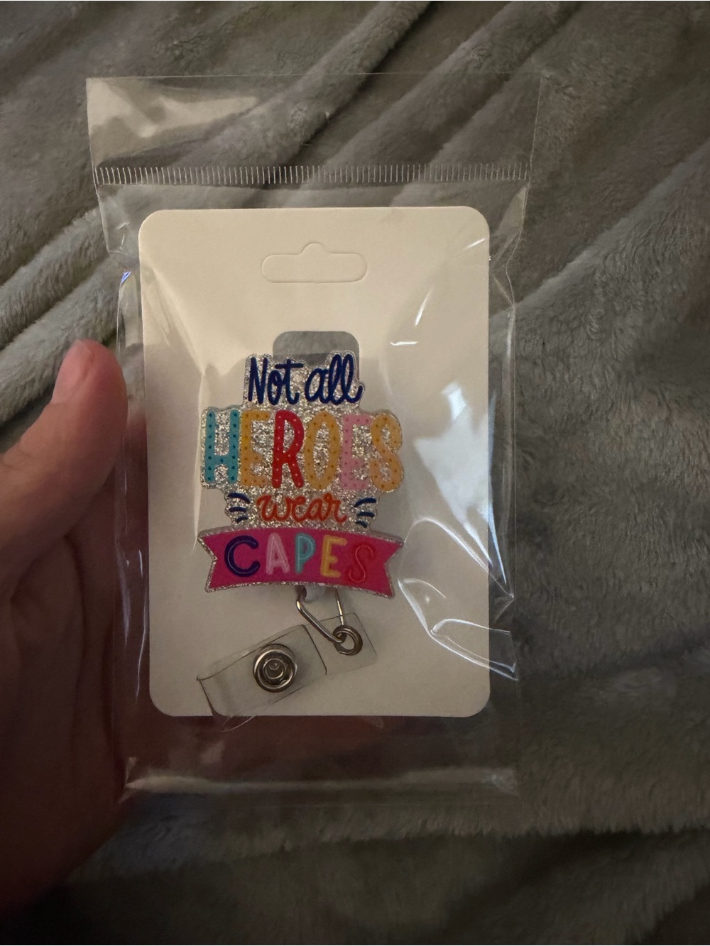 Multicolor 'Not All Heroes Wear Capes' Badge Reel Card Holder